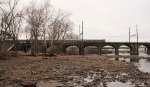 Cab car passes over a very low Delaware river.